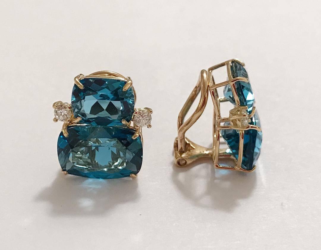 Elegant 18kt Yellow Gold Double Cushion London Blue Topaz Stone Earrings with Diamonds. 

This is a classic day to evening earring that can be made clip or pierced. The meaning measures 3/4' tall and 1/2