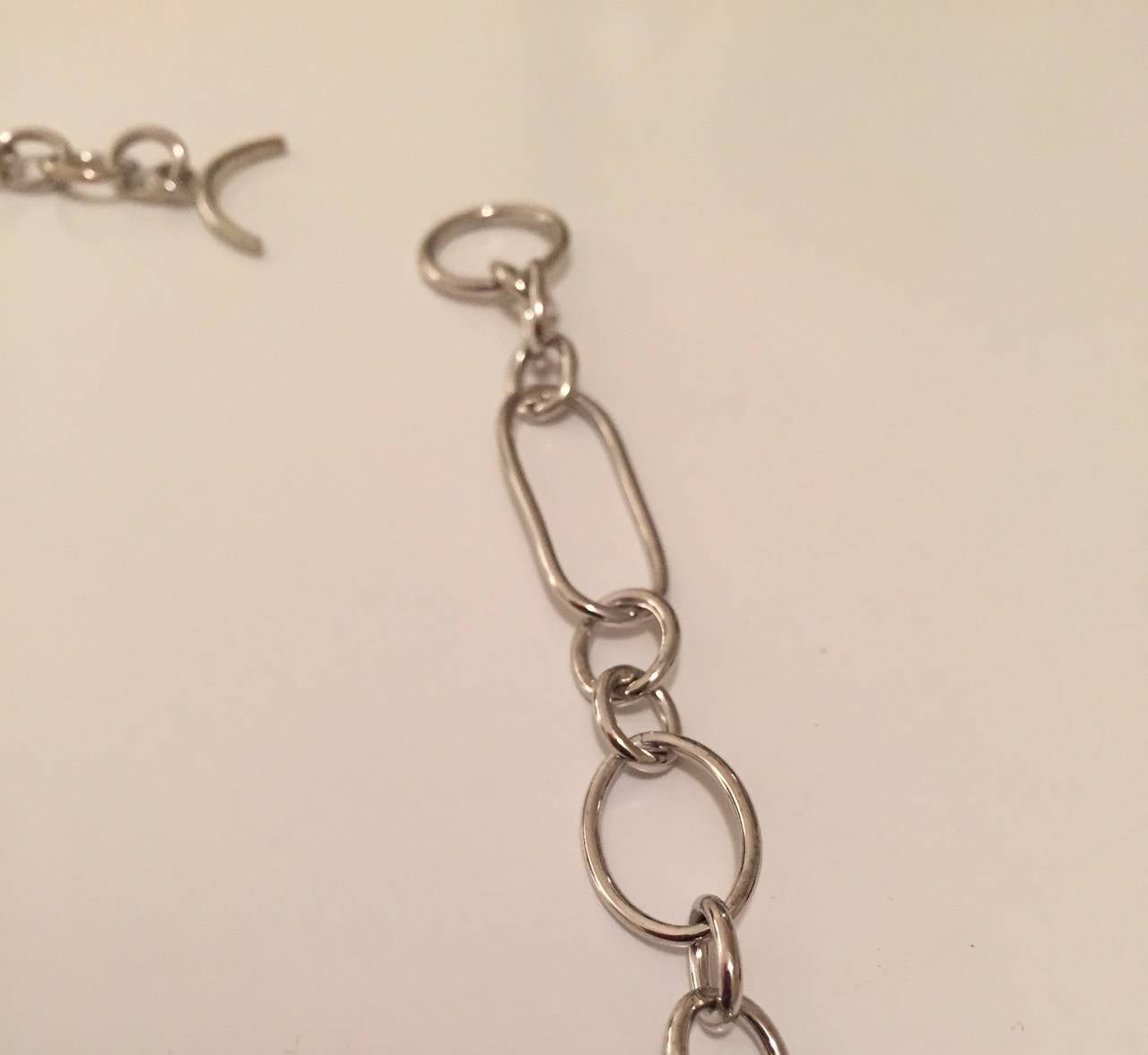 18kt White Gold Mixed shape hollow link necklace with Toggle closure finished at 24