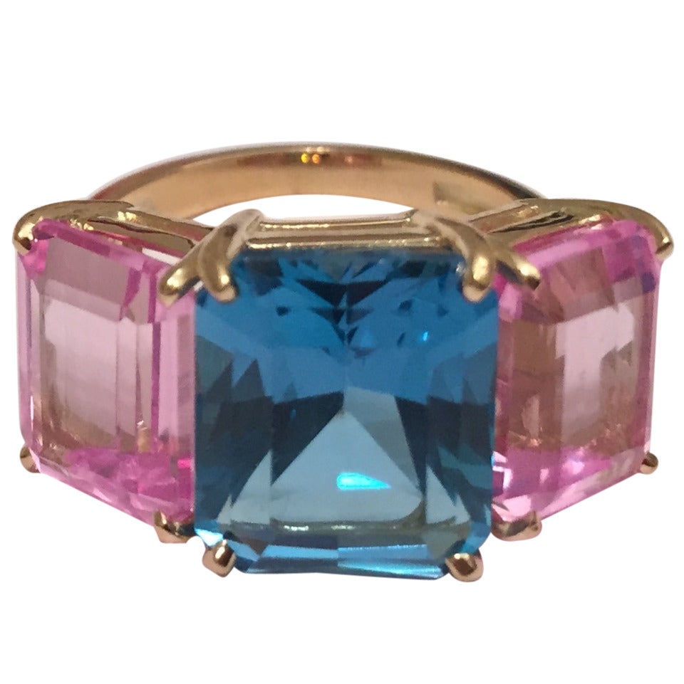 Bright Blue and Bright Pink Topaz Emerald cut three stone ring For Sale