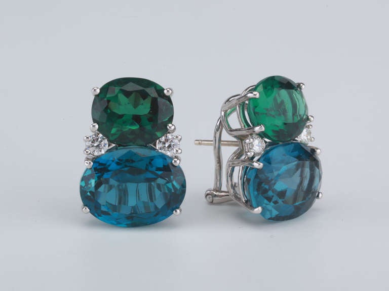 Large 18kt white gold GUM DROP™ earrings with tsavorite green garnet (approximately 5 cts each), dark blue topaz (approximately 12 cts each), and 4 diamonds weighing 0.60 cts. 

Specifications: Height: 7/8