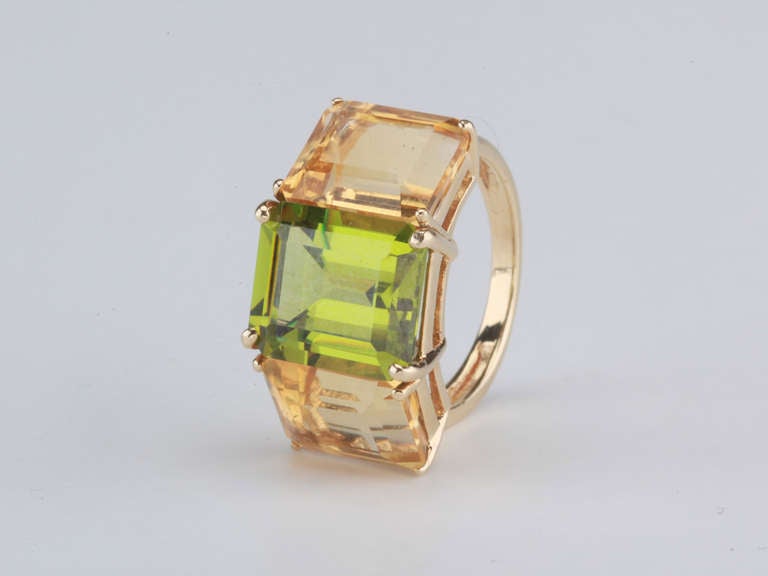 18kt yellow gold Emerald Cut ring with peridot (approximately 5 cts) and citrine (approximately 4 cts each).

The Ring measures approximately 1 