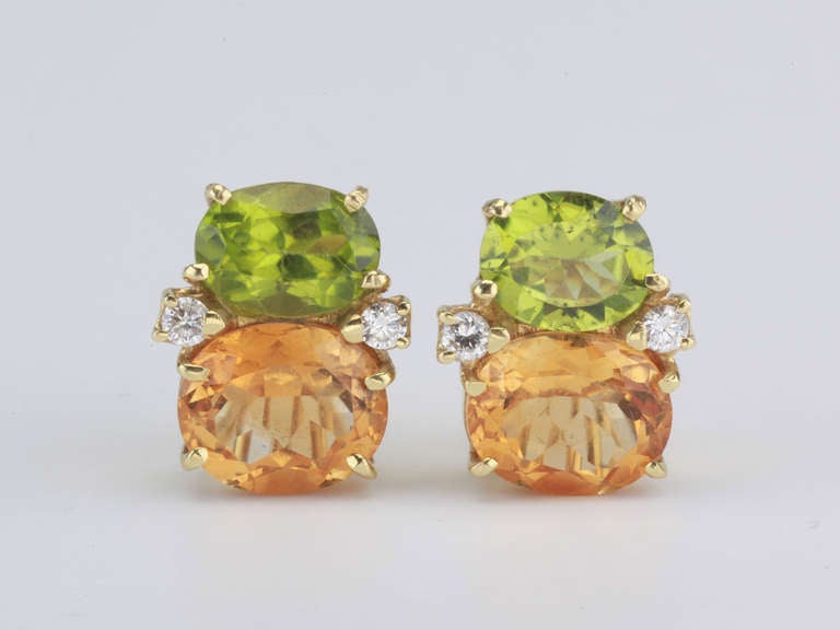 Medium 18kt yellow gold GUM DROP™ earrings with peridot (approximately 2.5 cts each), deep citrine (approximately 5 cts each), and 4 diamonds weighing 0.40 cts.

Specifications: Height: 3/4