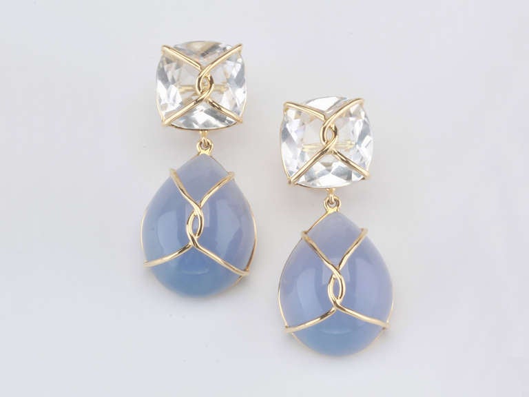18kt Yellow Gold Drop Earring with gold wrapped faceted cushion shaped Rock Crystal top and pear shaped cabochon chalcedony.

This elegant earring measures and inch and a half long. The top cushion is shaped Rock Crystal that measures half an inch