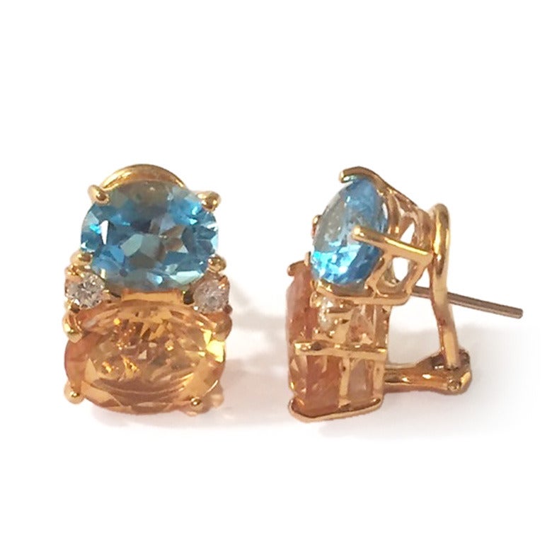 Medium 18kt yellow gold GUM DROP™ earrings with Blue Topaz (approximately 2.5 cts each), Citrine (approximately 5 cts each), and 4 diamonds weighing ~0.40 cts. 

These earrings are Perfect if you have Blue Eyes, Blond hair  or Red