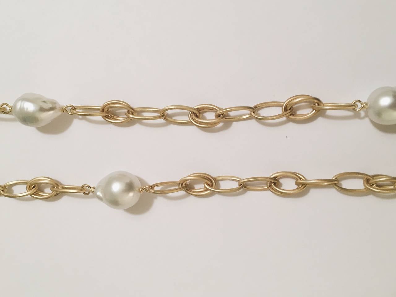 A Graceful 18kt Yellow Gold Marquise Link chain with Baroque Pearls.  This 35