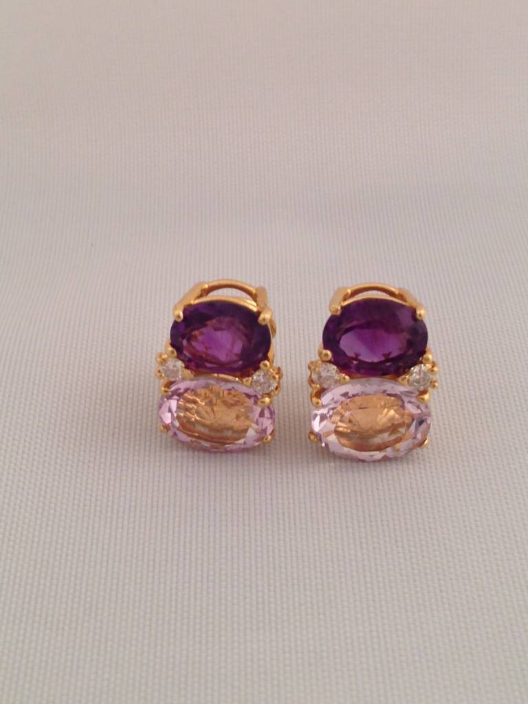 Medium 18kt Yellow Gold GUM DROP™ earrings with Pale Amethyst (approximately 2.5 cts each), Amethyst (approximately 5 cts each), and 4 diamonds weighing 0.40 cts.

Specifications: Height: 3/4