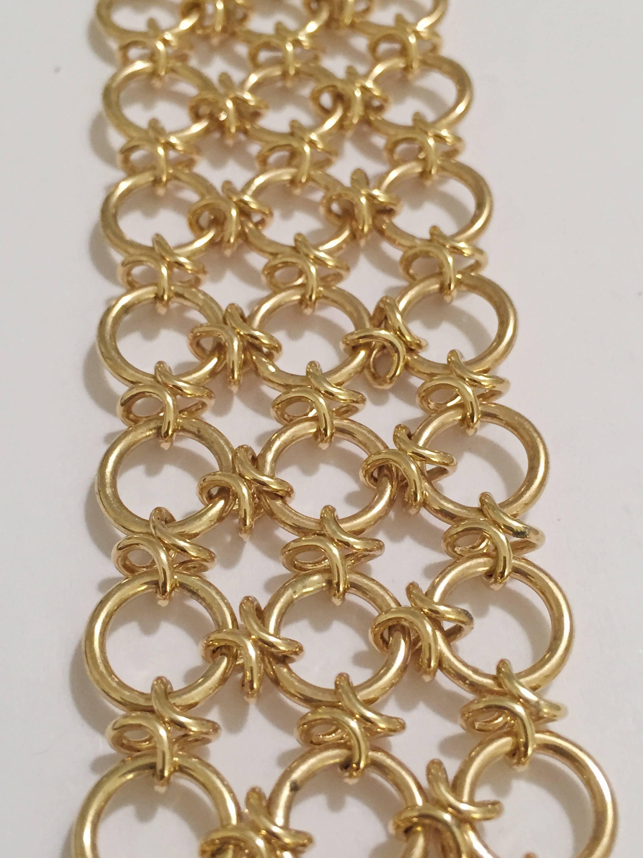 18kt Gold Three Row Circle Bracelet with circle shaped gold joints.  The elegant flexible bracelet measures just over 1.25