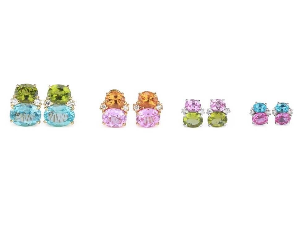 Medium 18kt Yellow Gold GUM DROP™ earrings with bright pink topaz  (approximately 2.5 cts each), bright blue topaz (approximately 5 cts each), and 4 diamonds weighing 0.40 cts.

Specifications: Height: 3/4