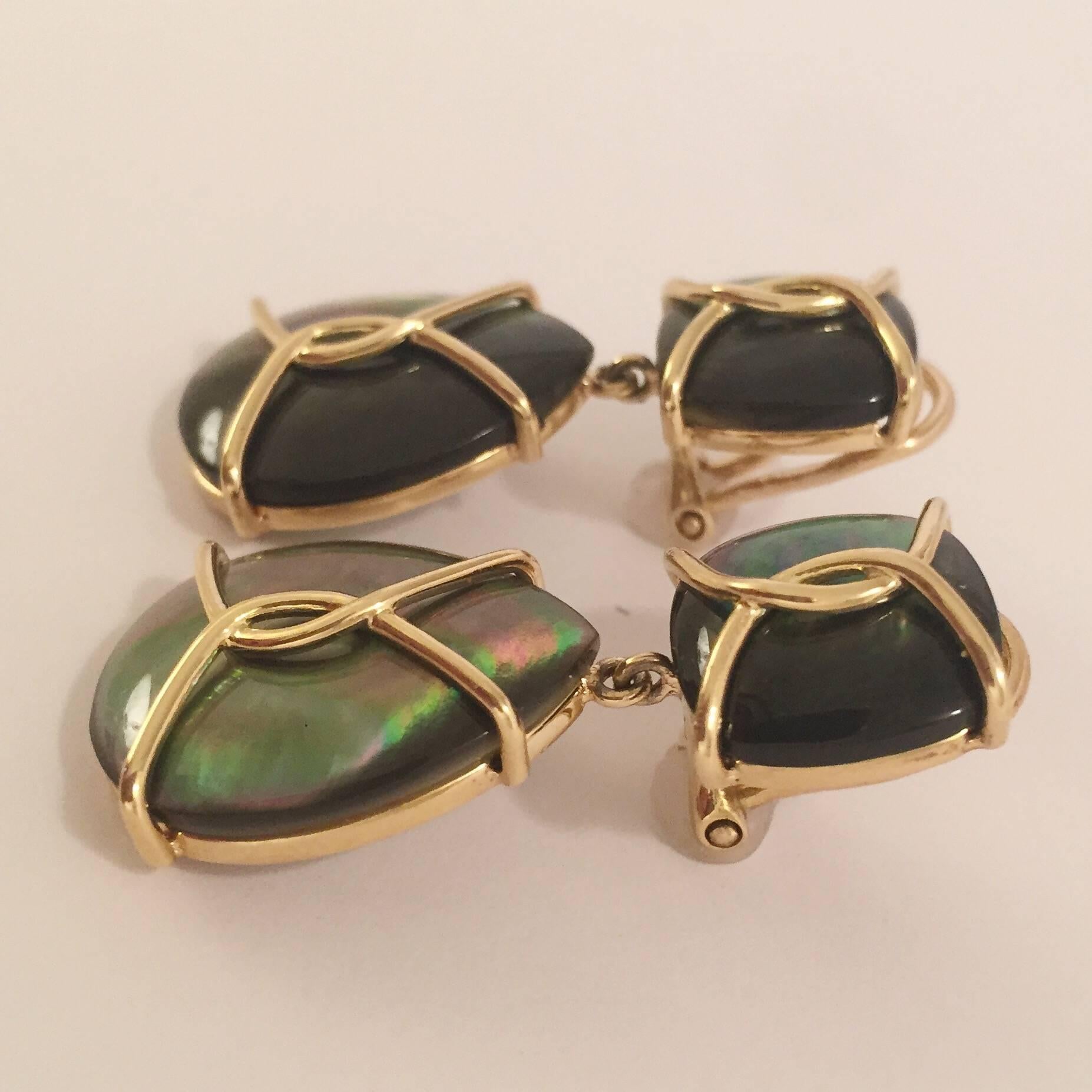 18kt Twisted Yellow Gold and Abalone Drop Earring.  

This elegant earring measures and 1 1/2 inches long. The top cushion shaped Abalone measures 1/2 inch wide. 

The bottom pear shaped abalone drop measures an 3/4 inch wide.  

The Earrings