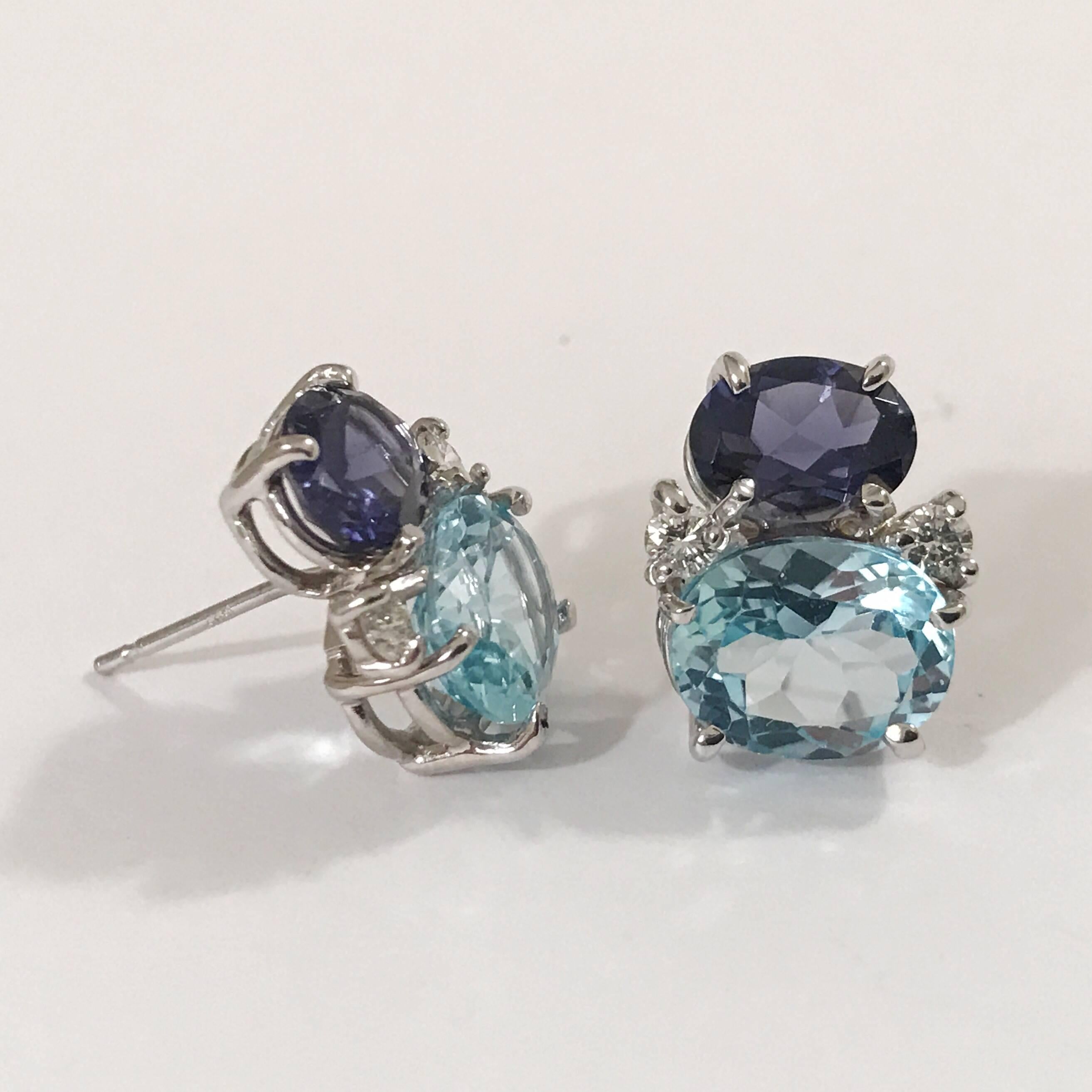 Mini 18kt white gold GUM DROP™ earrings with faceted Iolite (approximately 2 cts each), Faceted Pale Blue Topaz (approximately 3 cts each), and 4 diamonds weighing ~ 0.20 cts. 
Specifications: Height: 5/8