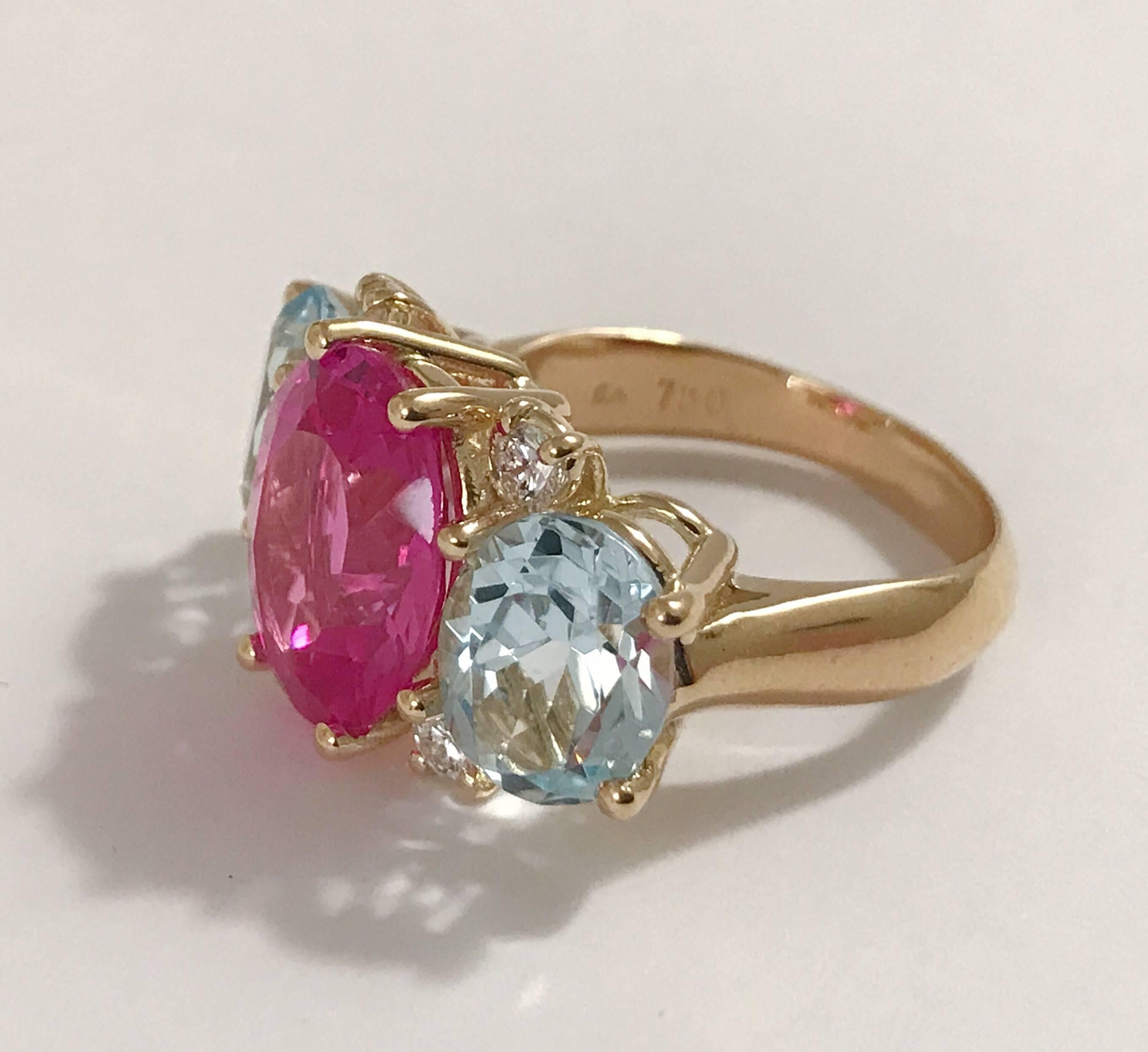 18kt Medium Three Stone Gum GUM DROP™ with Pink Topaz and Pale Blue topaz, and four diamonds weighing approximately .40 cts  This beautiful ring measures ~ 1