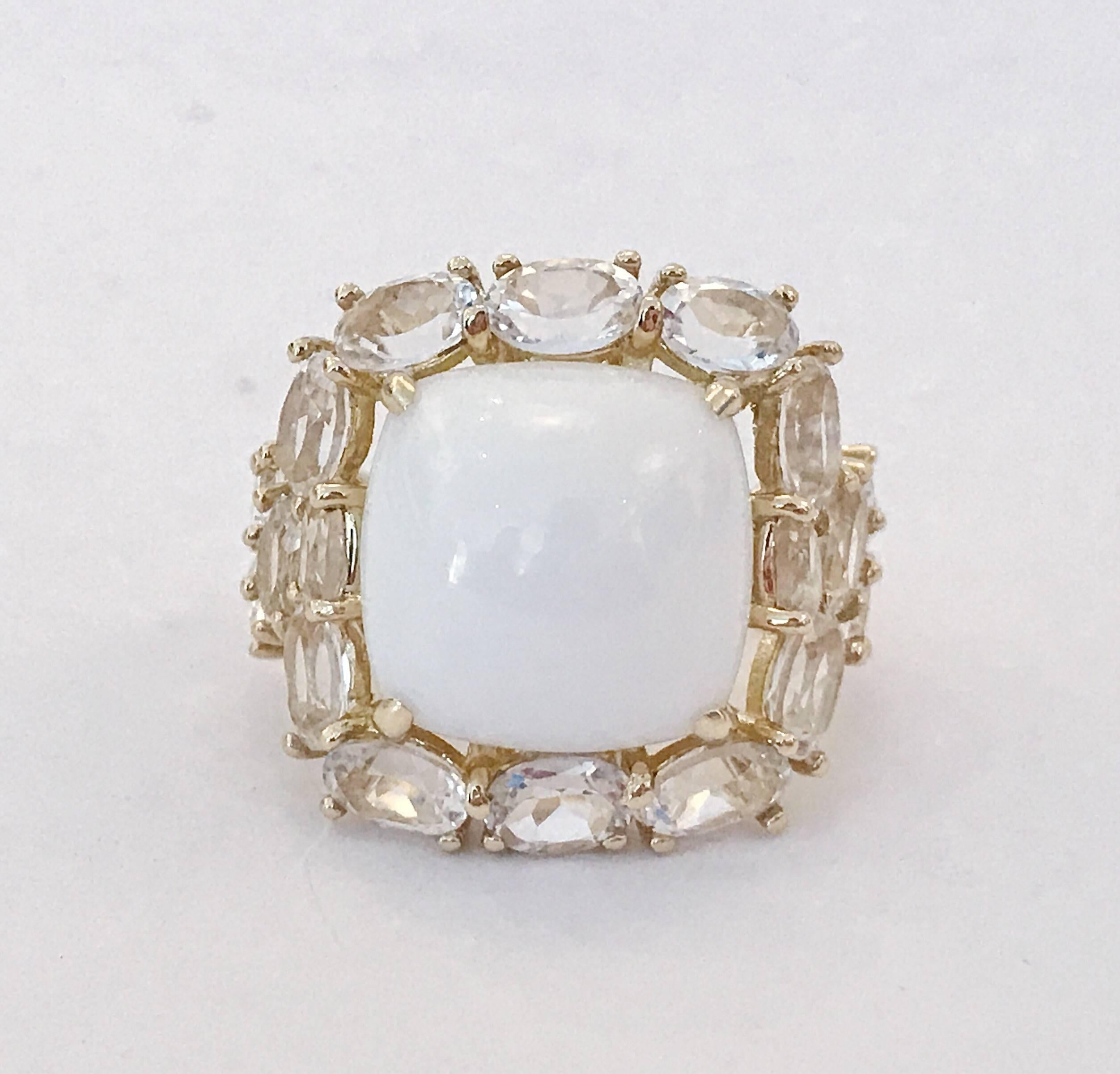 Elegant CLASSIC Cocktail Ring with large cabochon White Jade center surrounded by 18 oval faceted White Topaz adding some classic sparkle to your evening!

the ring measures approximately 1 1/4" diameter.

The Classic Cocktail ring can be made