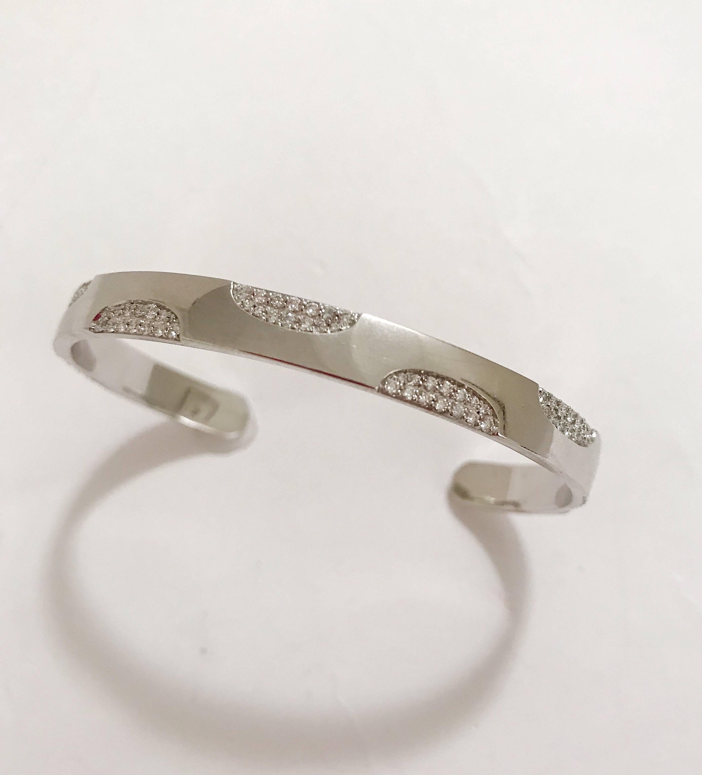 18kt White Gold Polka Dot Diamond Cuff Bracelet, is a great addition for stacking bracelets or is beautiful alone. 

This Bracelet can be made in any color gold and fits to all wrist sizes. 

Please contact us with any inquiries you may have.