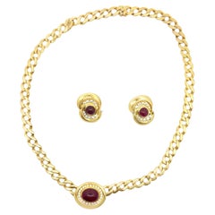 Fred Paris 1980, collana e orecchini con rubini e diamanti in oro 18 carati