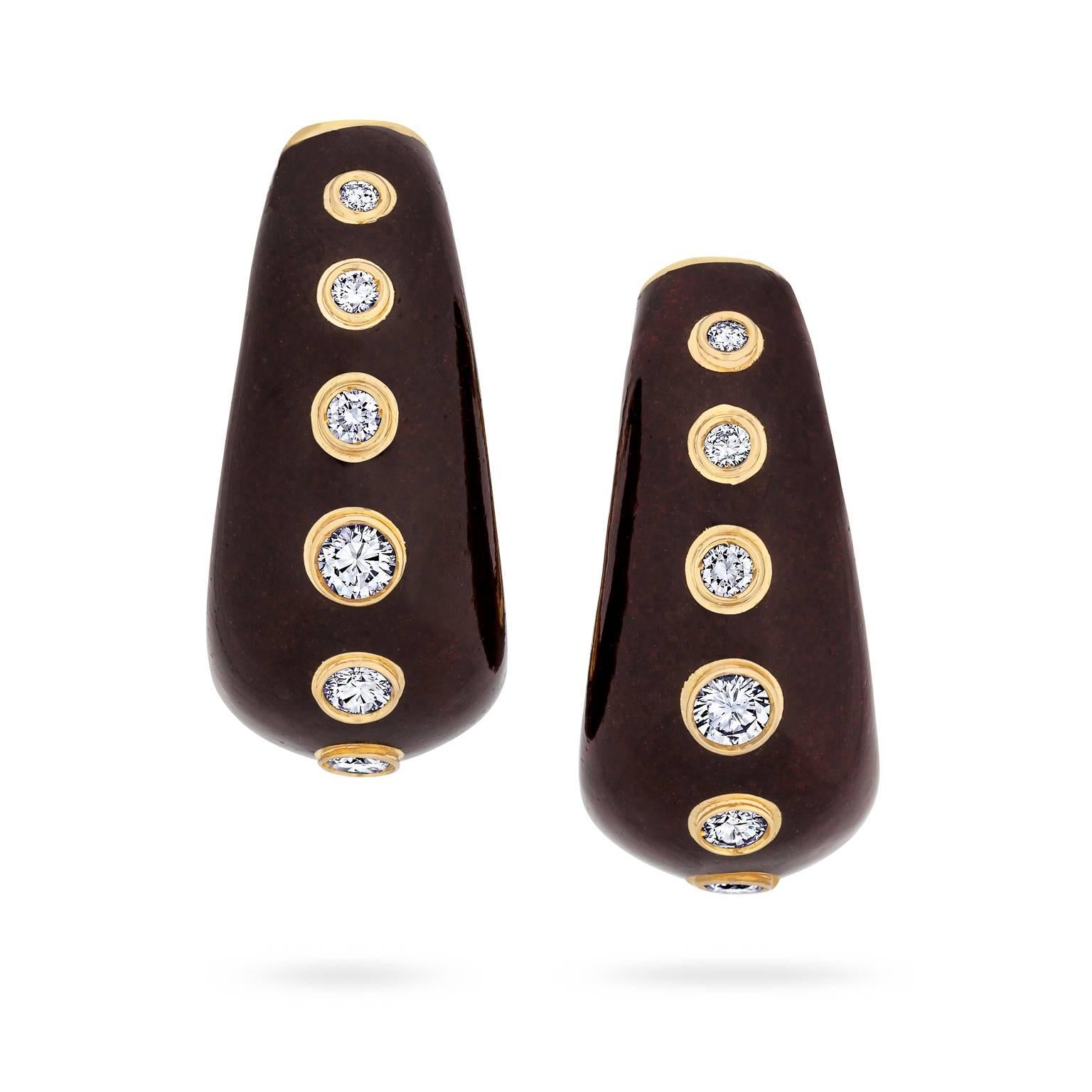 Hoop it up with these rare vintage Christian Dior diamond, gold, and enamel earrings!  Created in France in the 1970's, these chic oval shaped hoops are 18 karat yellow gold enameled in rich chocolate brown with a total of 1.50 carats of round bezel
