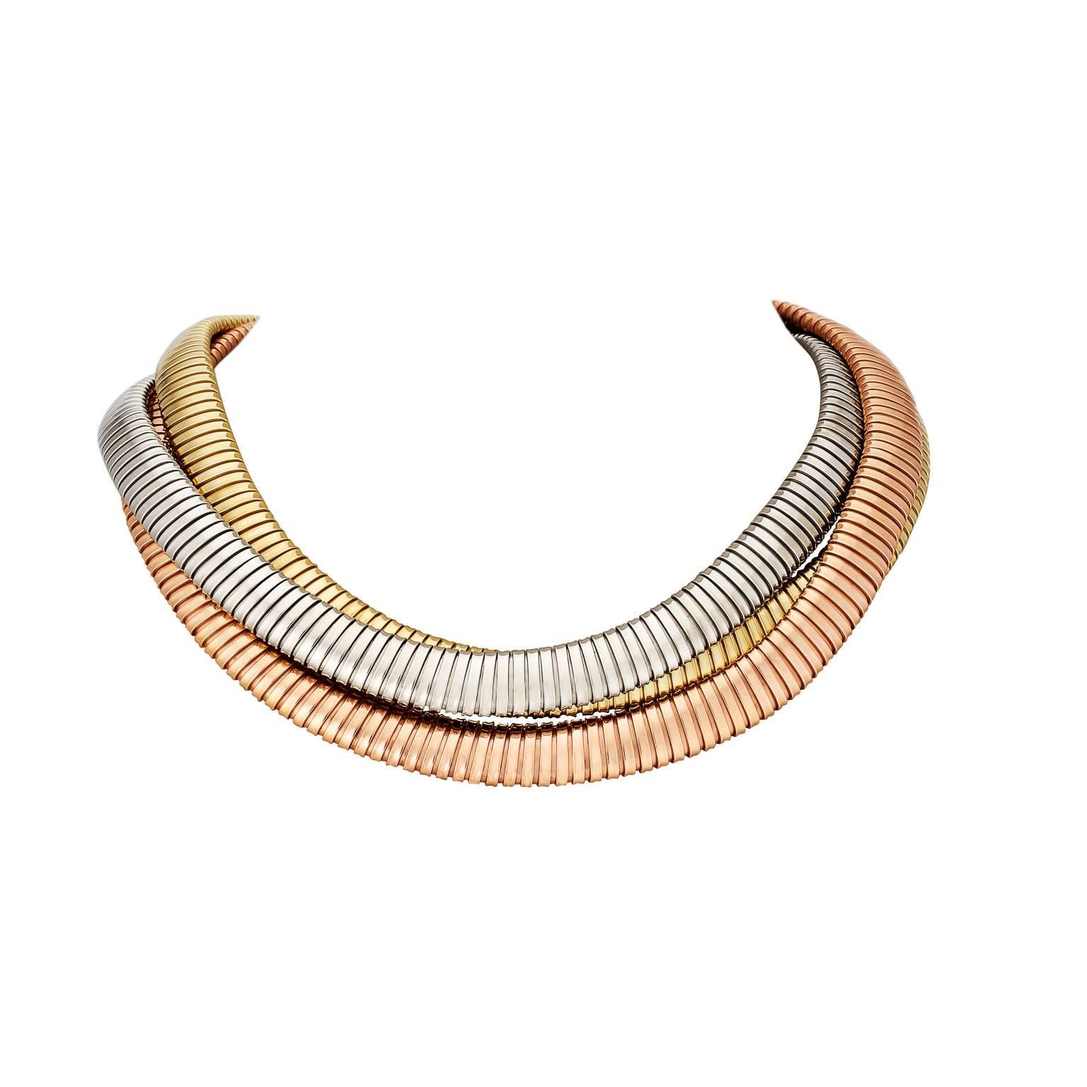 Inspired by the flexible metal piping from luxury sports car exhaust manifolds called tubogas in the 1920's, this handmade vintage rose, white and yellow gold necklace will wrap you in fashionable luxury.  Designed by Carlo Weingrill.  Made in