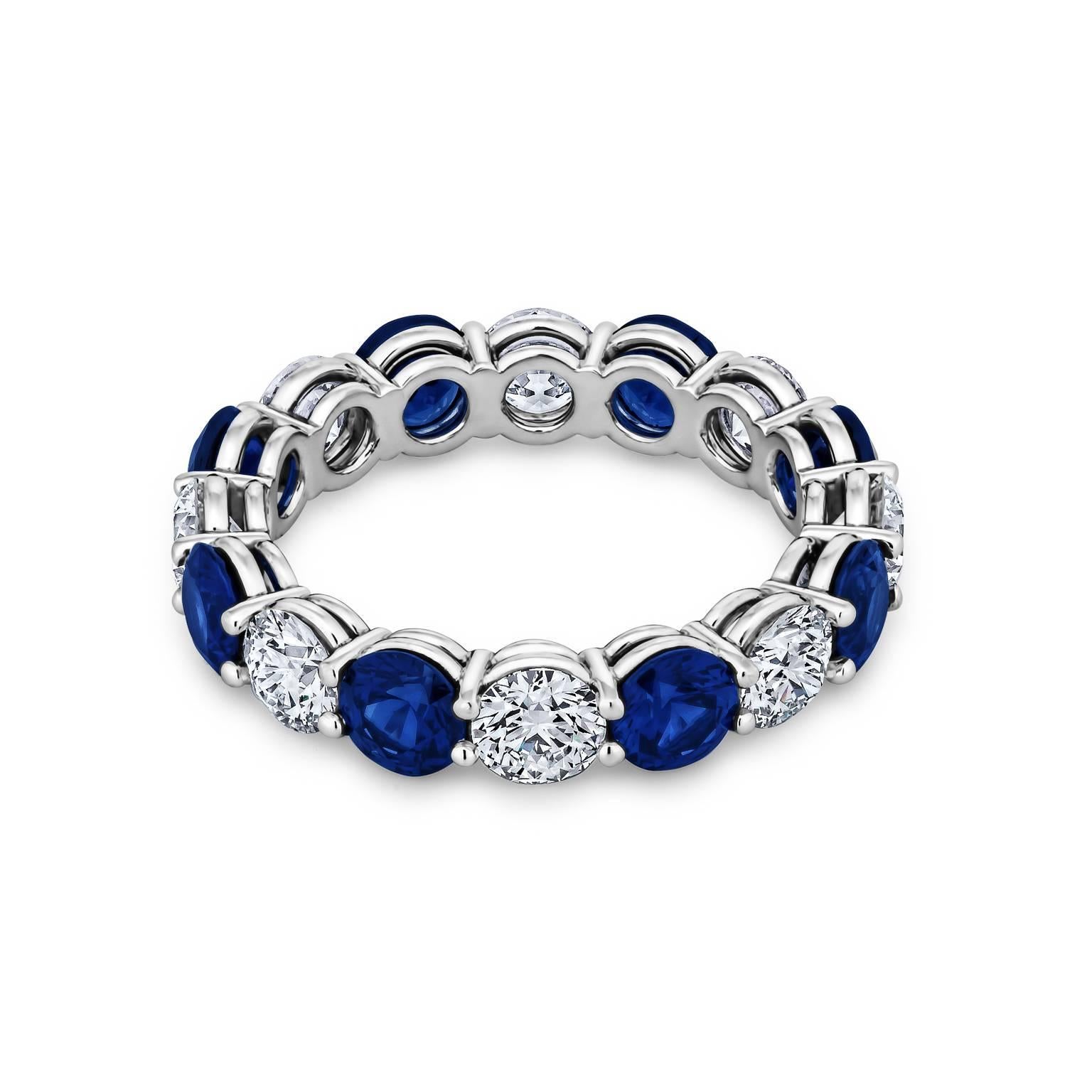 Handmade round ideal cut diamond and sapphire platinum shared prong band ring.  Designed by Steven Fox.  Total diamond weight 2.01 carats.  D-E color/VVS clarity.  Total Sapphire weight 2.72 carats.  Size 6.  Can be custom ordered to size.    