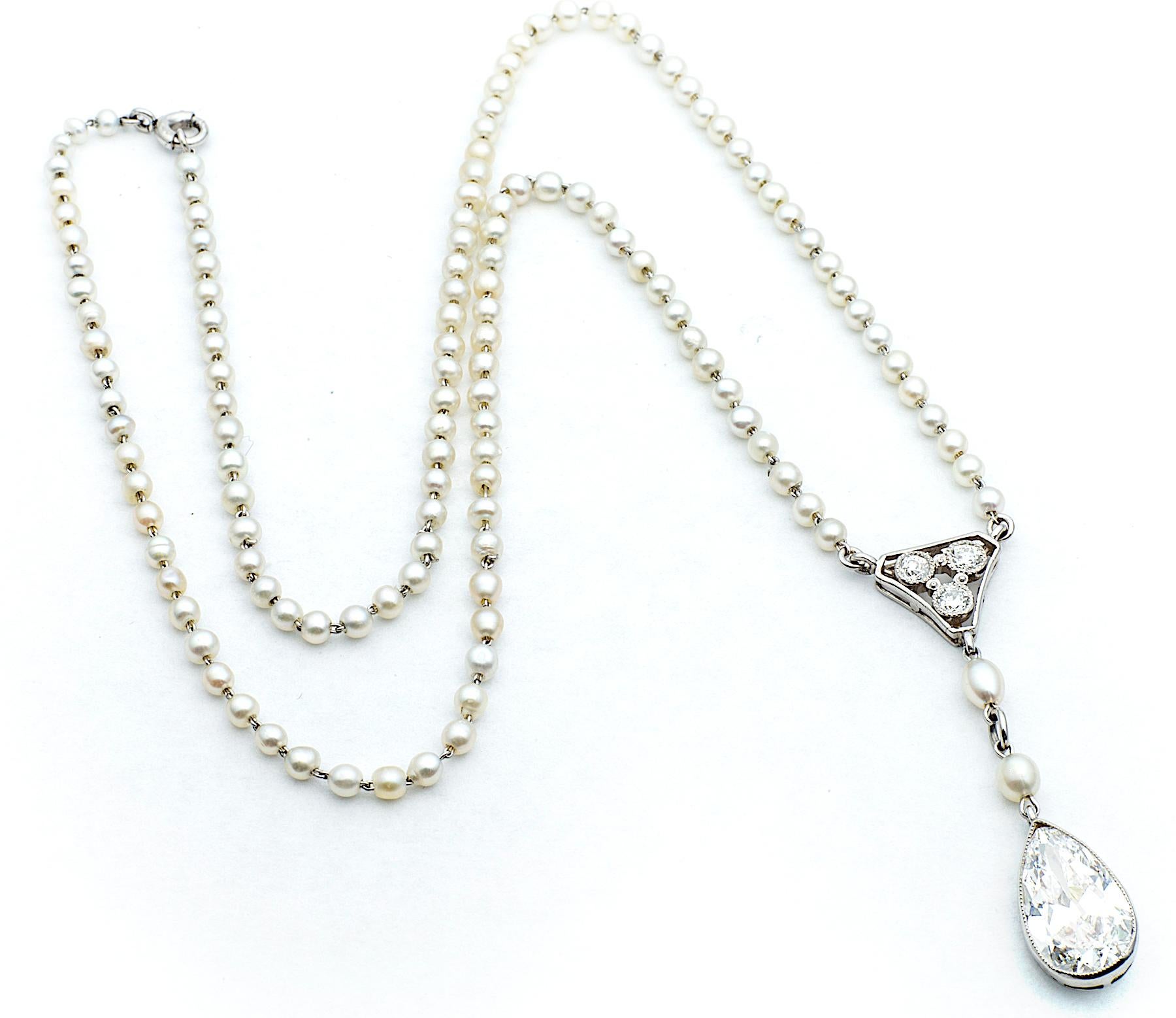 This delicately feminine diamond and natural pearl necklace is certain to become a timeless heirloom.  
The handmade 16