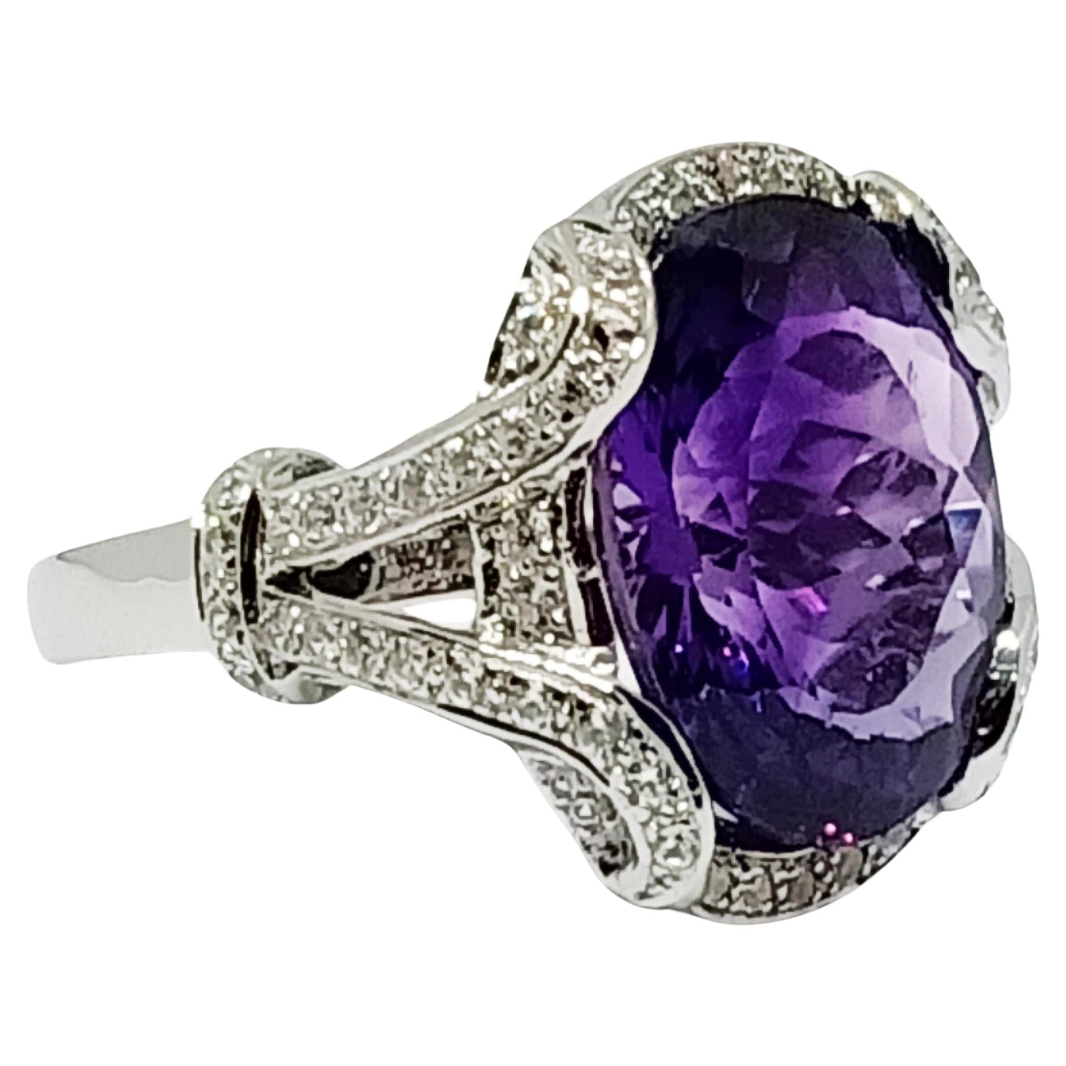 African Amethyst Oval 16.7x12.5 mm. (8.56 cts)  1 pc.
White zircon 1.25mm 66 pcs.
Over sterling silver in 18K white gold plated.
Size 7.25 US.

Search ( storefront , seller ) Ornamento jewellery
