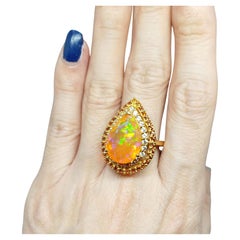 7.86cts. Orange Opal Ring. Sterling Silver 18k gold Plated.
