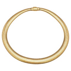 Collana girocollo vintage Cartier Tubogas in oro giallo 14 carati