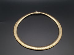 Collana girocollo vintage Cartier Tubogas in oro giallo 14 carati