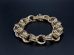 Heavy 14K Yellow Gold Interwoven Circular Link Charm Bracelet