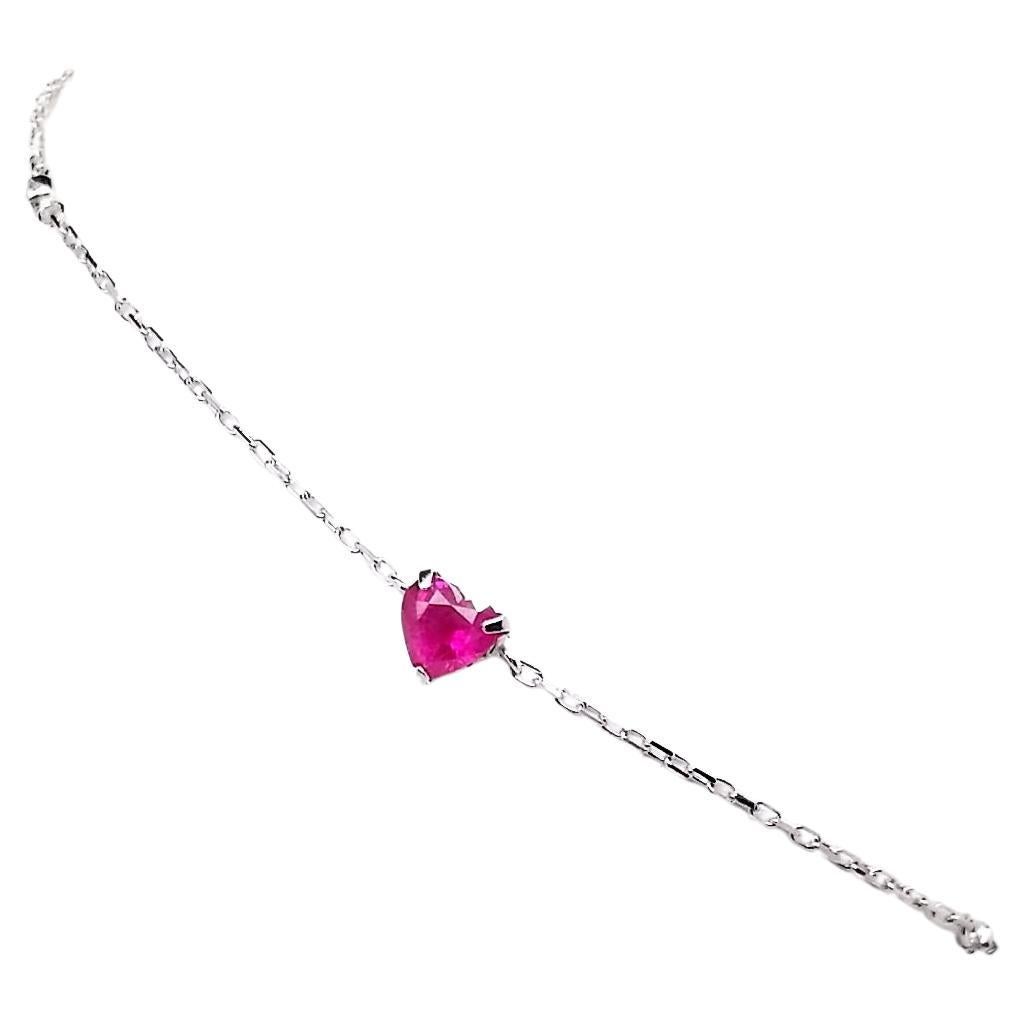 Elegant 18K White Gold Bracelet featuring 0.87ct Natural Burma Rubies and 0.02ct Natural Diamonds.
This refined piece showcases 3 Heart Mixed-Cut Rubies, originating from Burma, in a stunning Intense Pink Red hue with transparency and natural