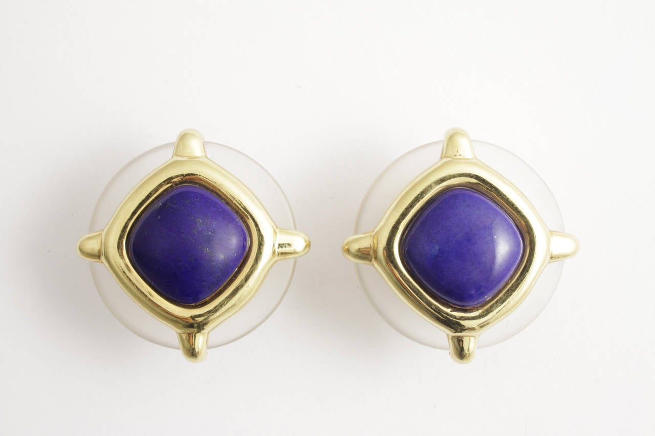 A pair of elegant earrings designed by remarkable Italian designer Aldo Cipullo in 1973, presenting rock-crystal and lapis lazuli on a fine 18kt yellow gold mounting.