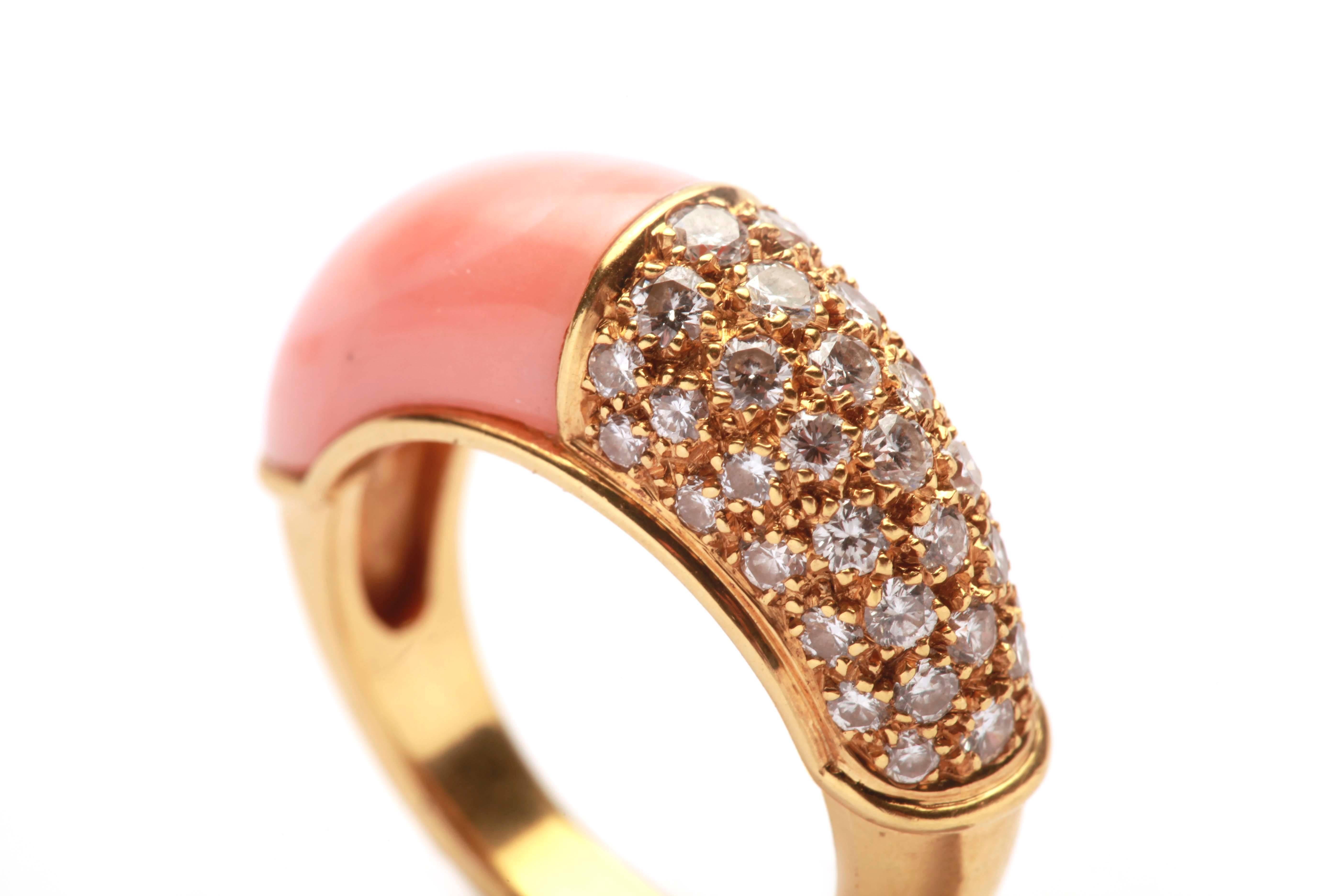 A gracious ring in 18kt yellow gold, set with diamond pavè and pink coral. Made in France, circa 1960.

