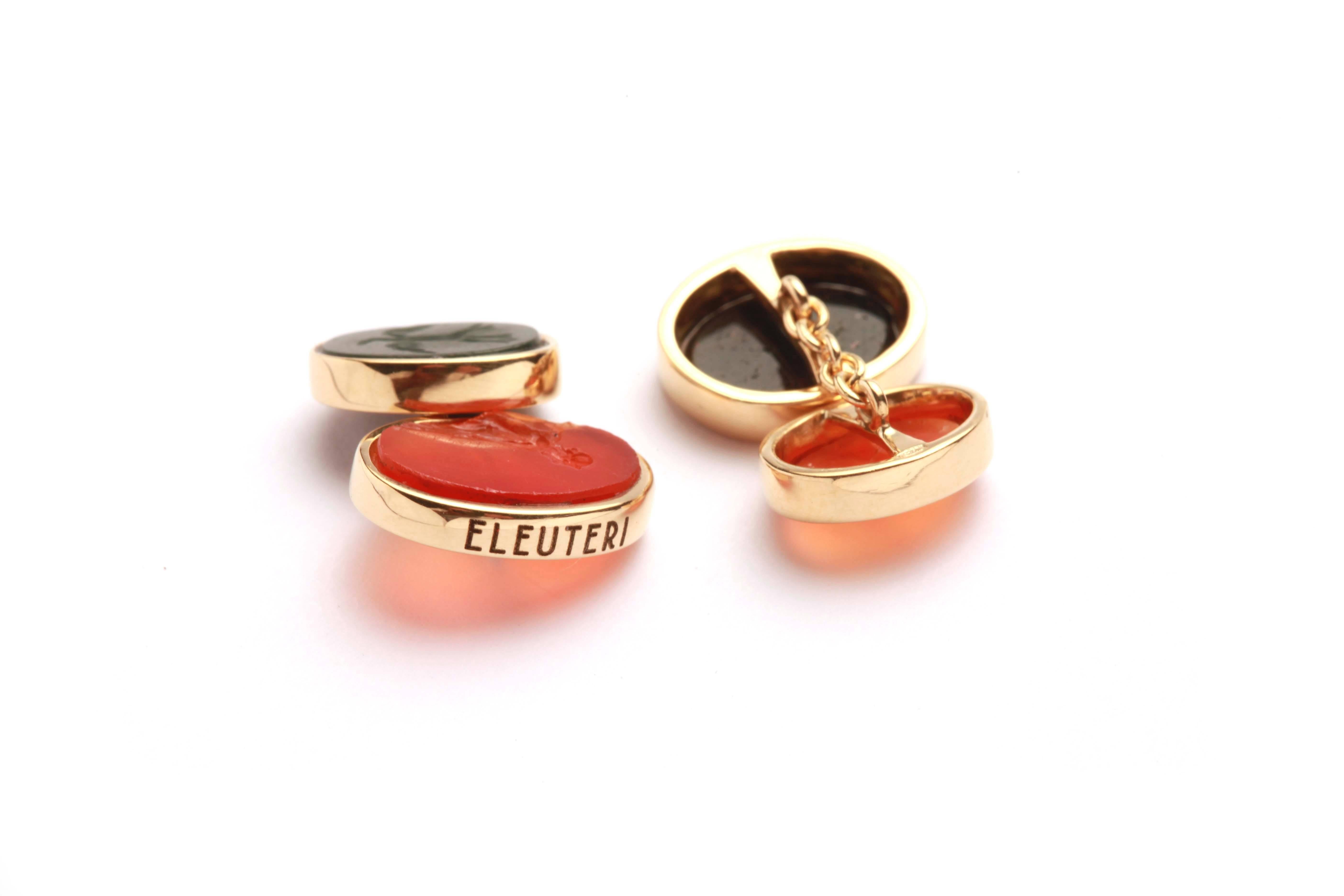 A pair of ancient Roman cornelian and diasper intaglios, resumed from archeological excavation, elegantly set in 18kt yellow gold by Eleuteri.