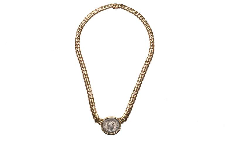 A chain necklace sold by Bulgari in Milan in July 1976 (please refer to sales certificate in the images), part of the Coins collection, presenting an antique Roman 