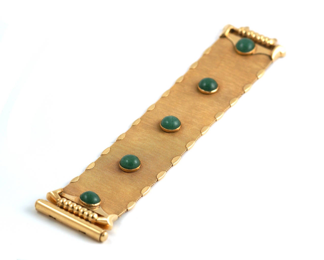 An unusual bracelet in knitted 18k yellow gold, embellished by five dome shaped aventurines as well as a stylised buckle. Italy, circa 1970