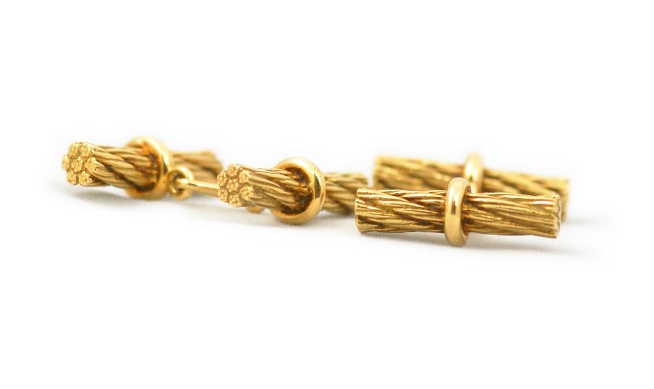 A pair of straight bar design Cufflinks resembling a golden marine rope. Mounted in 18kt yellow gold. Signed Hermes Paris, circa 1970.