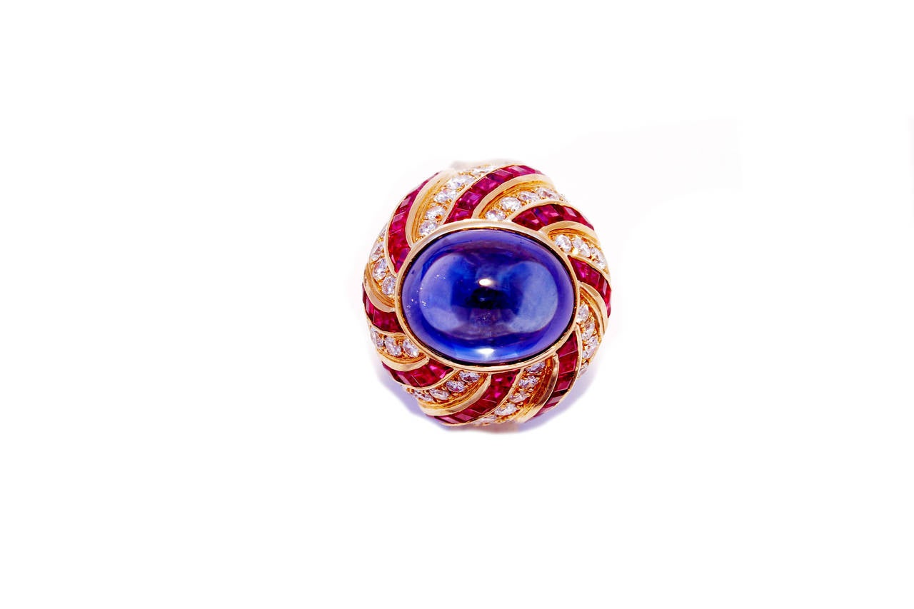 A powerful cocktail ring manufactured by the Northern-Italian house Illario, notable makers for Bulgari as resembled in the item, presenting an 8ct cabochon blue sapphire, sustained by an exquisite vortex shaped 18kt yellow gold structure,