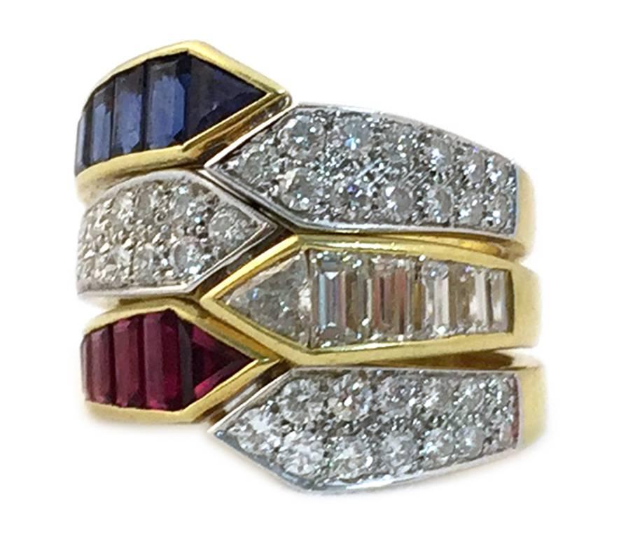 A combination of three rings 18kt gold of identical geometrical design, one with baguette cut and round cut diamonds, one with baguette cut rubies and round diamonds, and the third with baguette cut sapphires and round cut diamonds. Wearable all