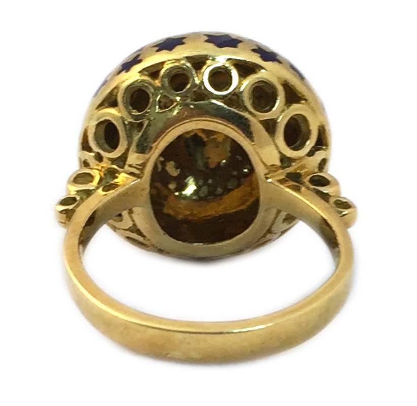 A chic dome shaped 18kt yellow gold ring, highlighted with blue enamel star decorations. Italian marks, circa 1975.