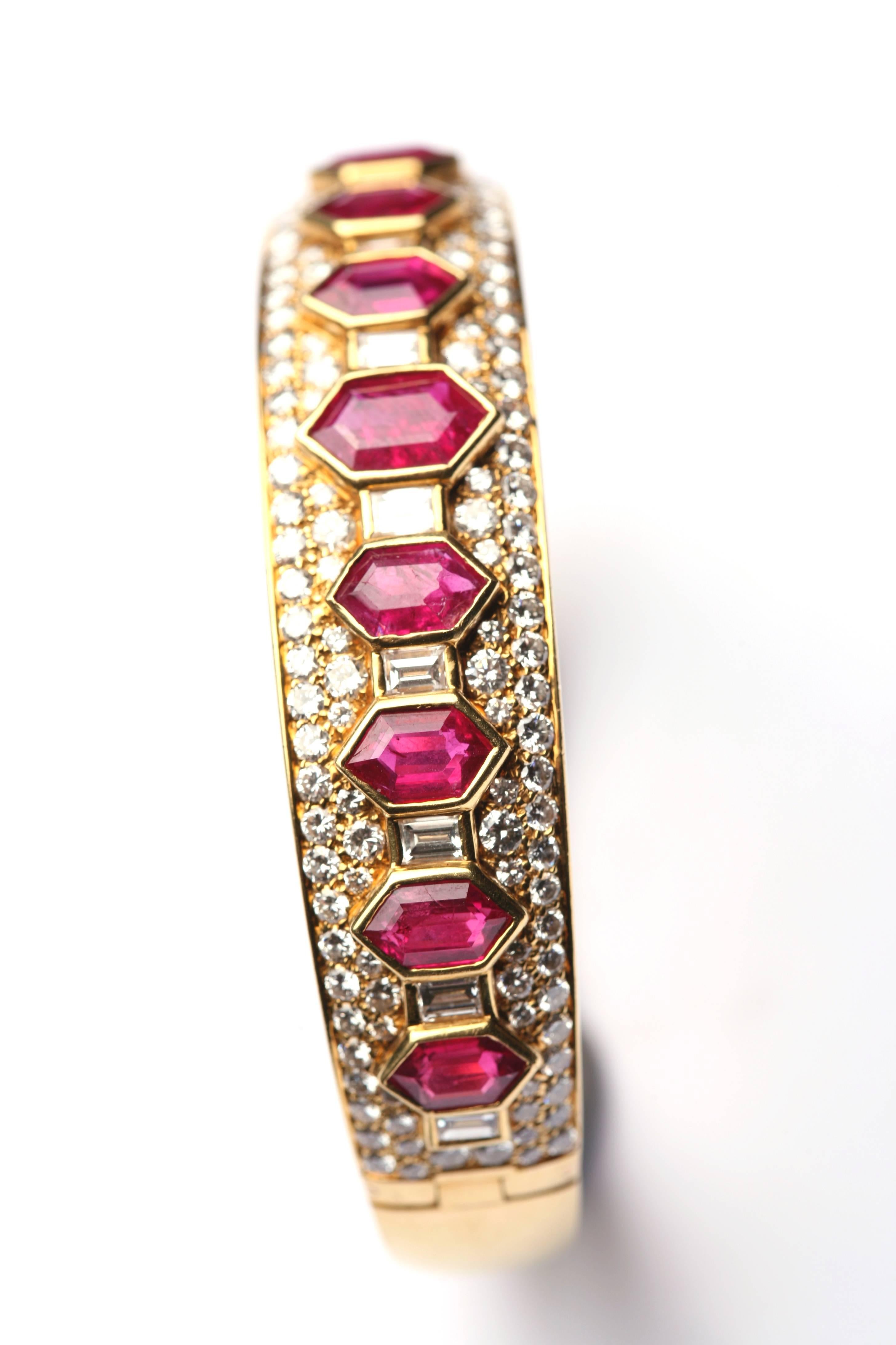 An iconic ruby and and diamond bangle of geometrical design, by Bulgari, circa 1965.