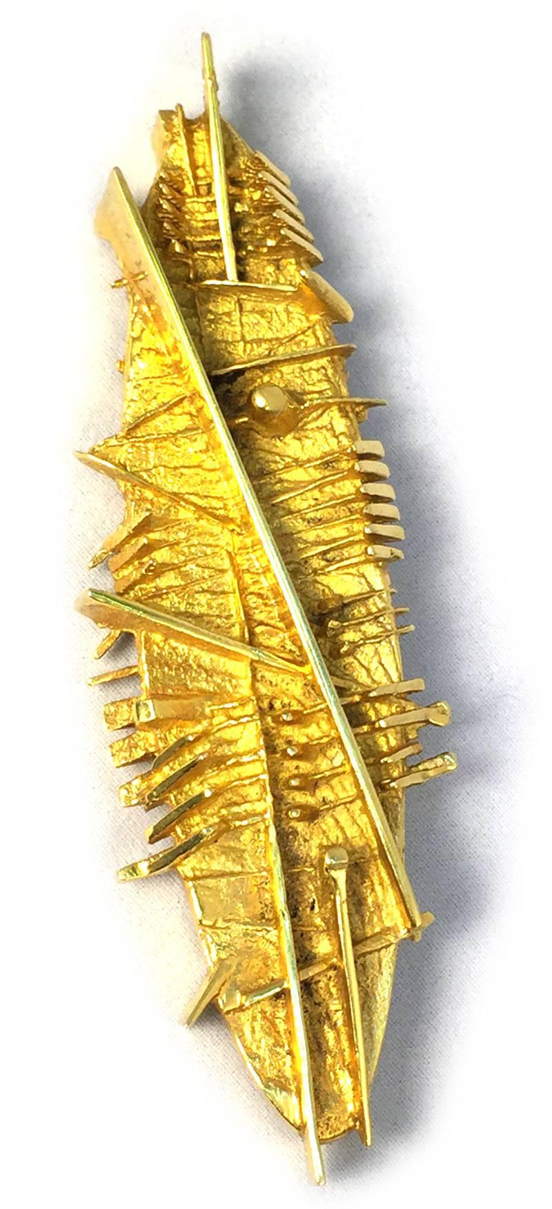 arnaldo pomodoro gold brooch