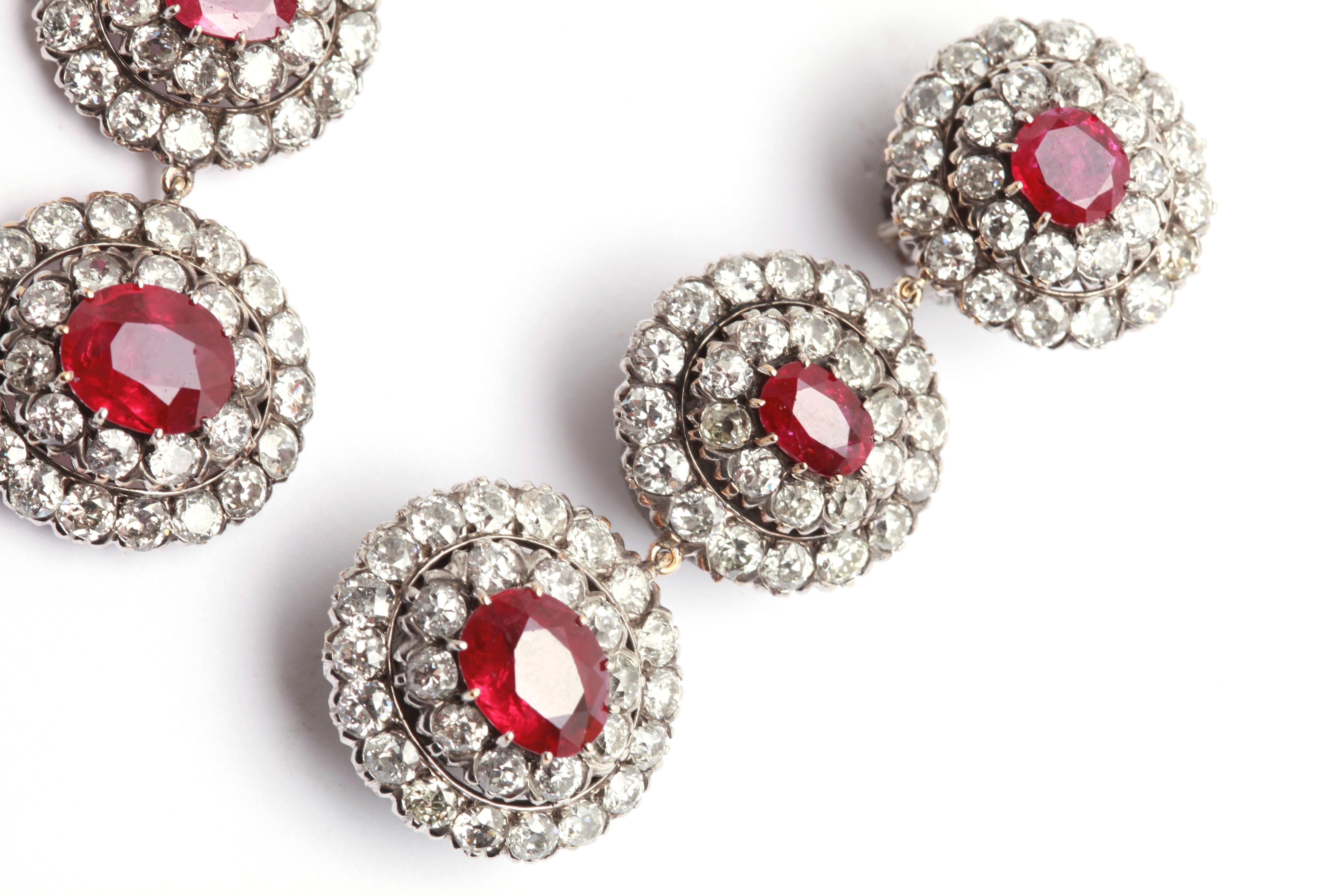 An important pair of fine Burmese rubies and old cut diamond ear pendants, mounted in platinum, circa 1930. 