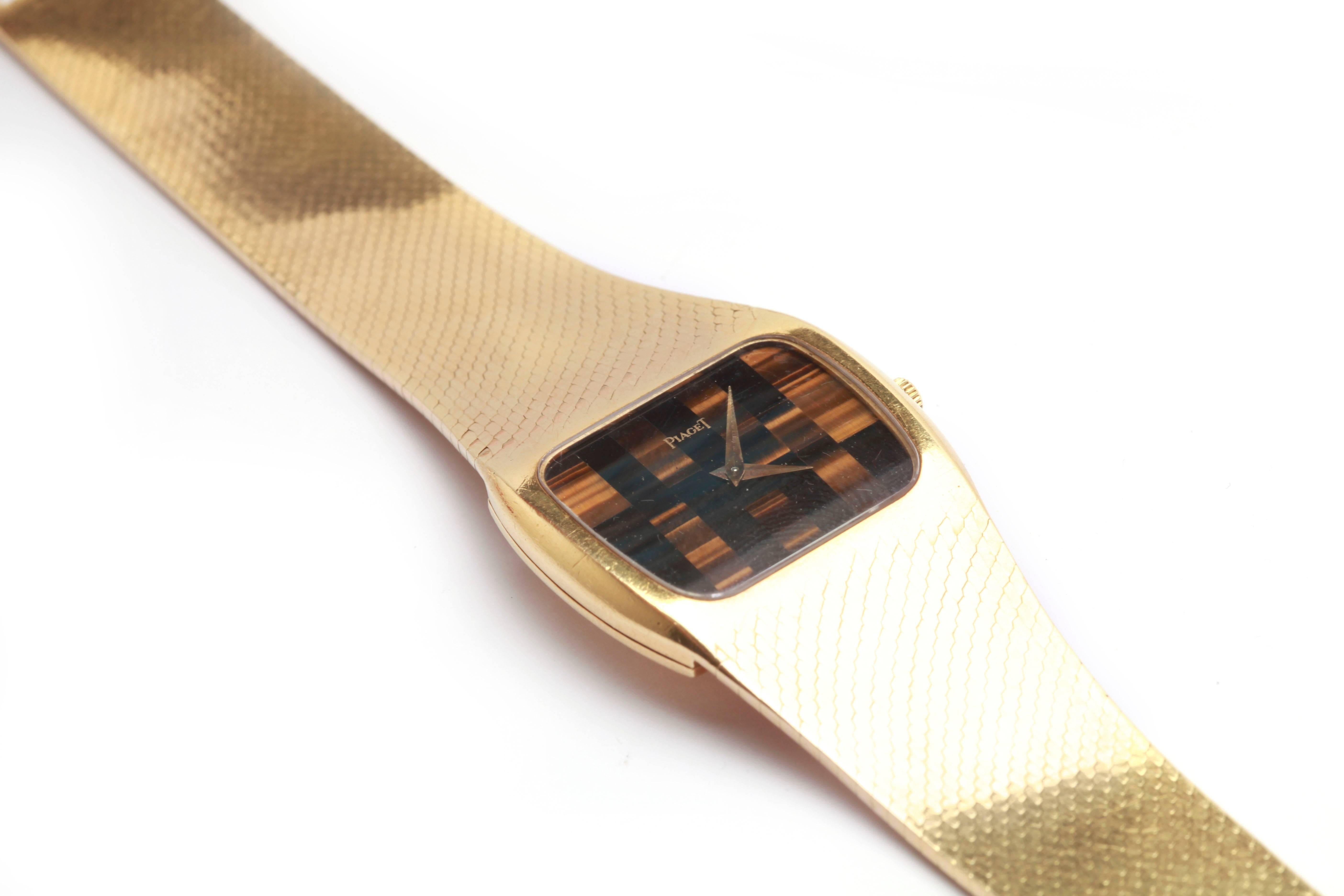 An unusual Piaget gold wristwatch from the 1970s, the dial being in Tiger’s Eye.
