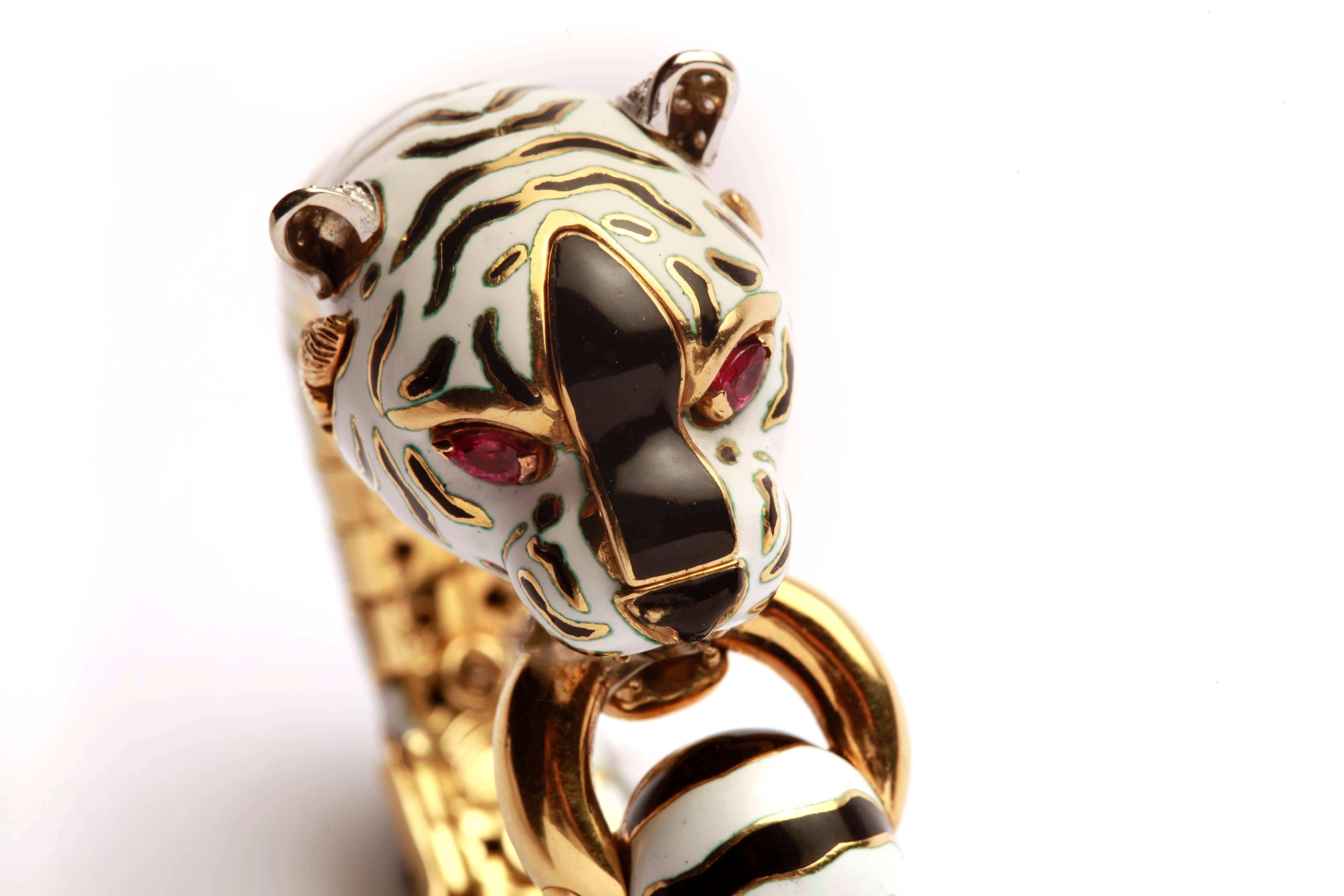 An iconic 18kt yellow gold bracelet by northern Italian master Frascarolo, representing a white Bengala Tiger, decorated with fine black and white enamel, as well as ruby eyes. Made in Italy, circa 1975.