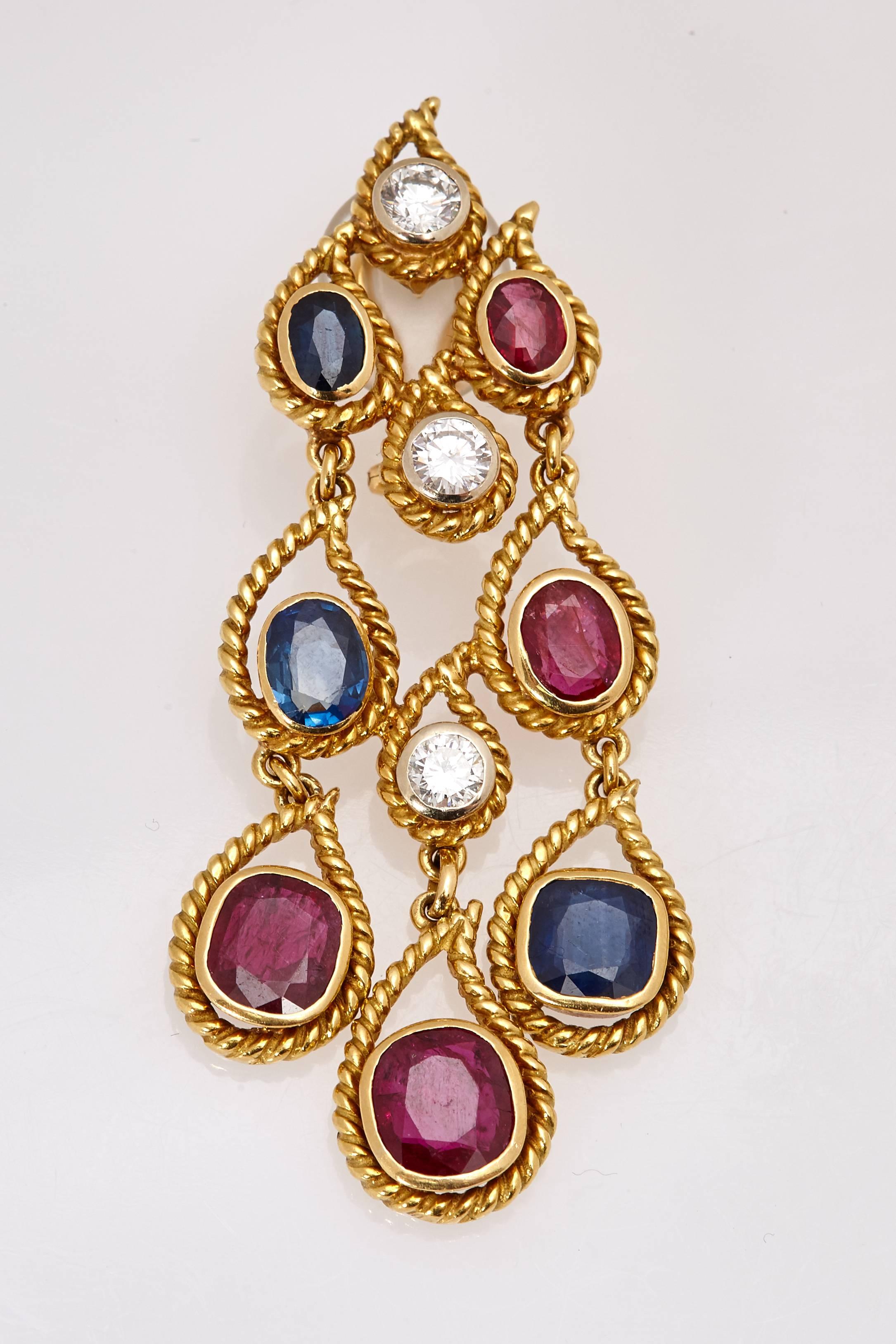 A pair of rope design rubies, sapphires and diamond ear pendants, mounted on 18kt yellow gold. Made in Italy, circa 1975.