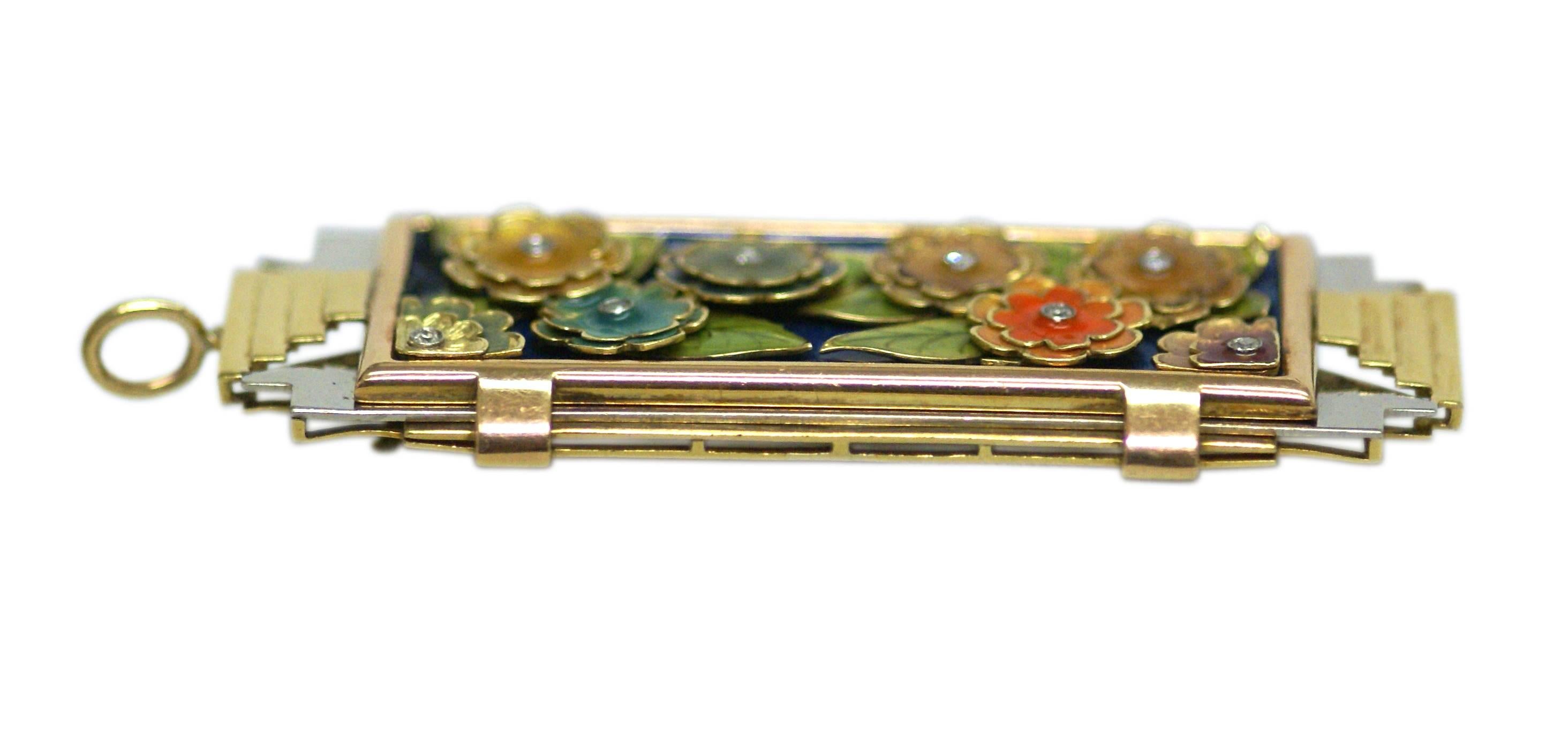 An exquisite Arts & Crafts brooch, combining an early Art Deco geometrical shape with the typical Art Nouveau floral enamel decorations; highlighted by small round cut diamonds. United States, circa 1910.