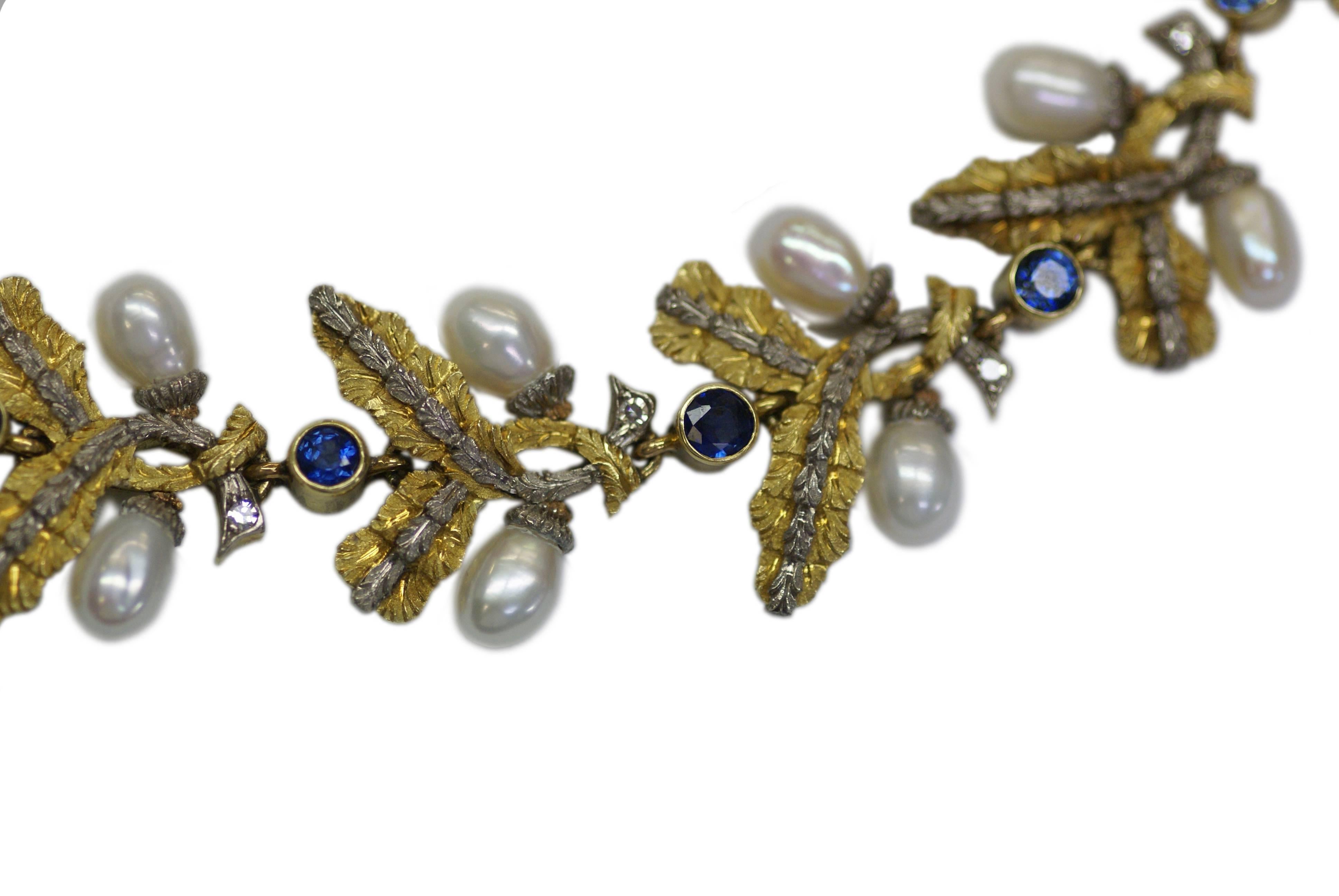 A sophisticated necklace of folate design by historical roman jeweler Cazzaniga, presenting pearls and sapphires on a mixed 18kt yellow and gold mounting. Italy, circa 1965.