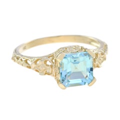 Sky Blue Topaz Filigree Engagement Ring in 9K Yellow Gold