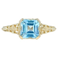 Sky Blue Topaz Filigree Engagement Ring in 9K Yellow Gold
