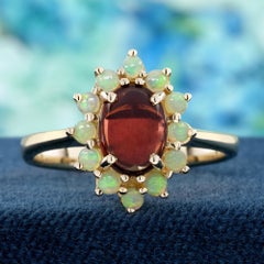 Garnet Cabochon and Opal Floral Halo Ring in 9K Yellow Gold