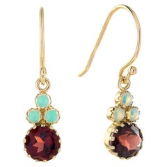 Ohrringe mit Granat- und Opal-Cluster in 9-karätigem Gelbgold