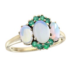 Three Oval Opal and Emerald Three Stone Ring in 9K Yellow Gold